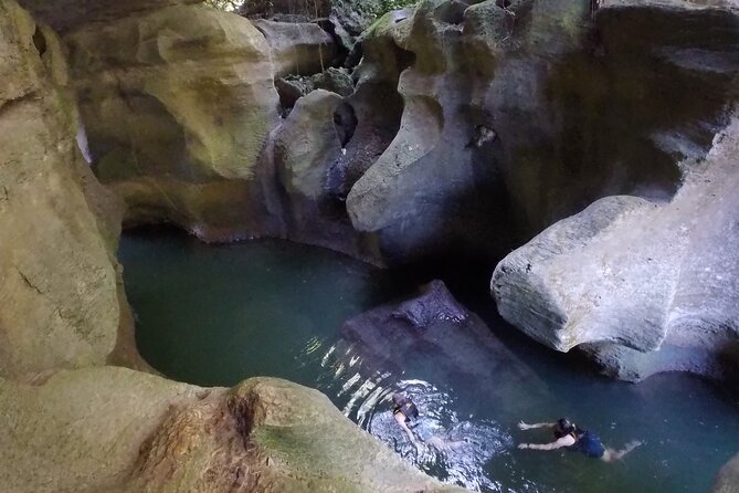 Cave Adventure - Charco Azul Caves, Canyon & Waterfall Adventure - Arenales Caves: Underground River Swimming and the Low-Light Reality