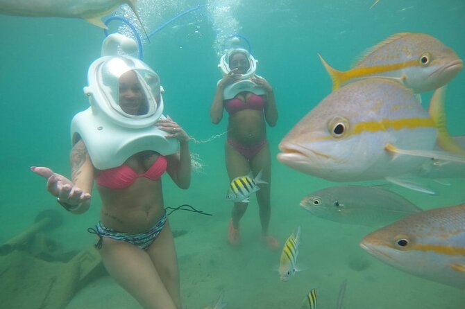 Underwater Sea Trek in San Juan: Explore Beneath the Waves - Entering the Caribe Hilton cove in a helmet