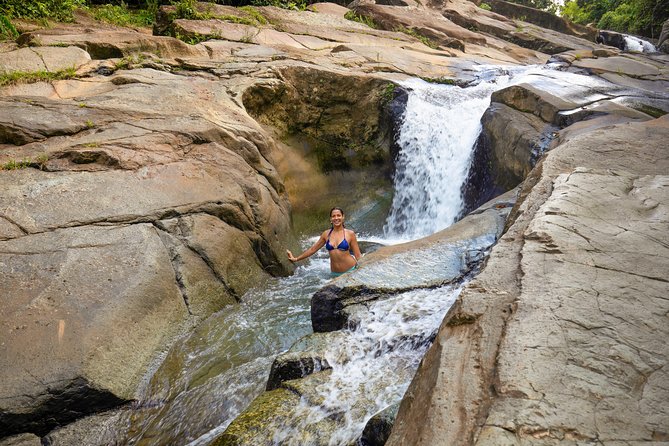 Yunque Rainforest River Rope Swing with Waterslide and Beach Tour - Luquillo first stop: volcanic rock, waterfall vibes, and rock-jump energy